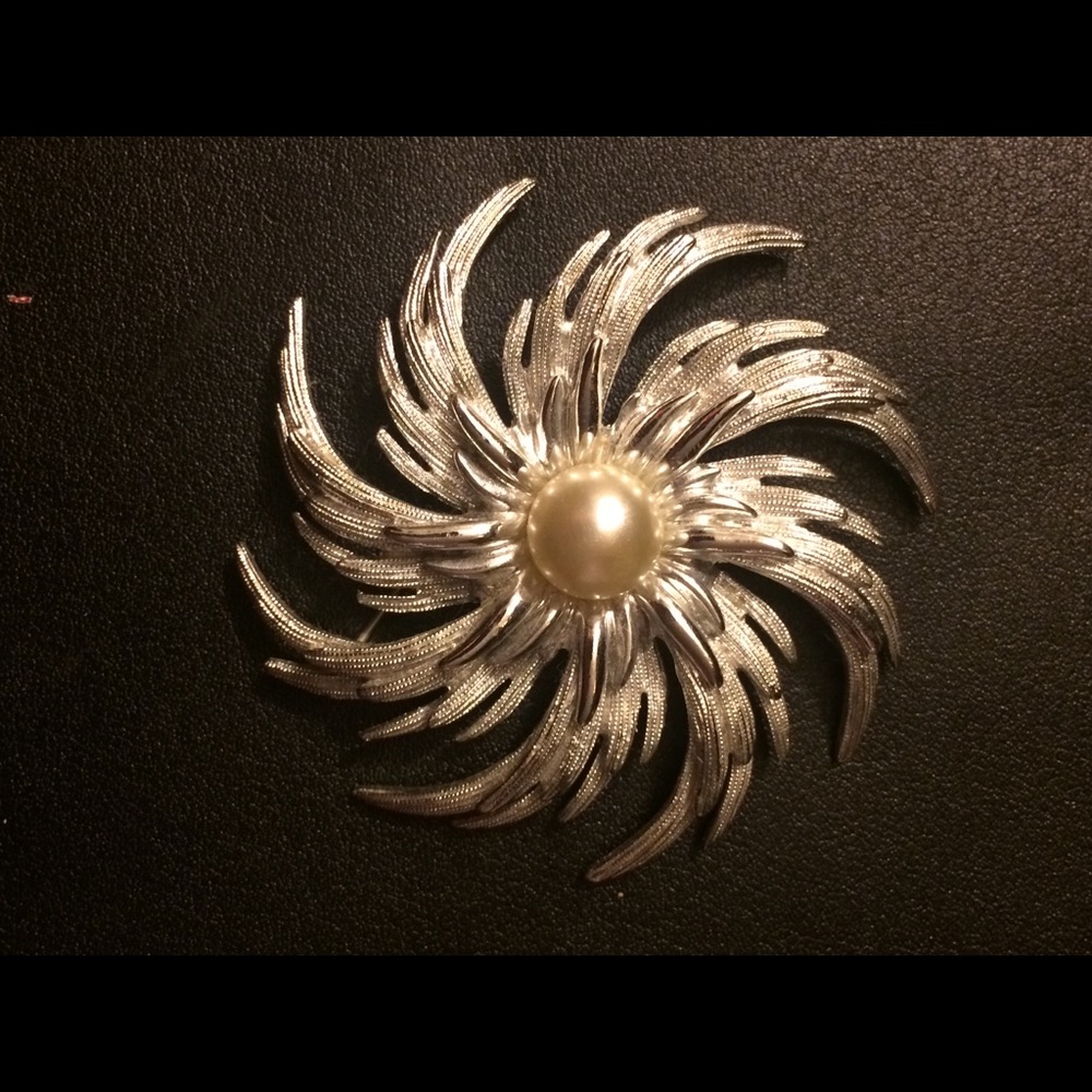 Silver brooch with pearl center